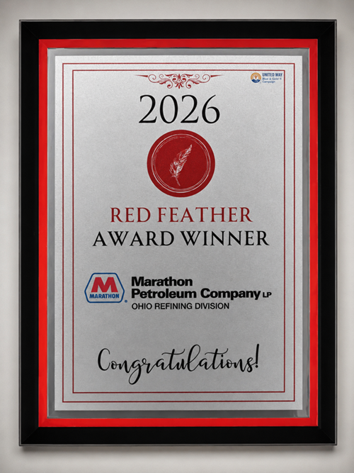 An award is displayed on a table at an awards banquet.