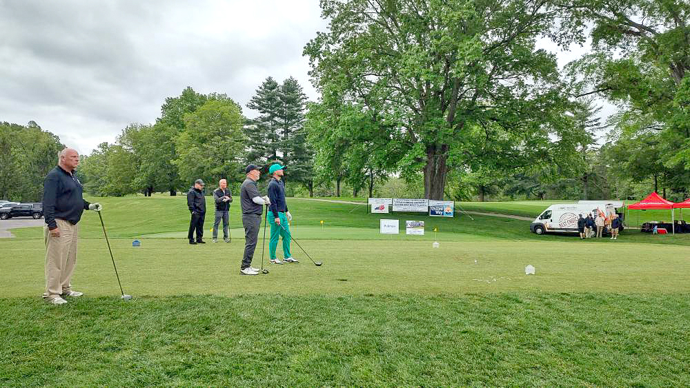 Golfers on a golf course.