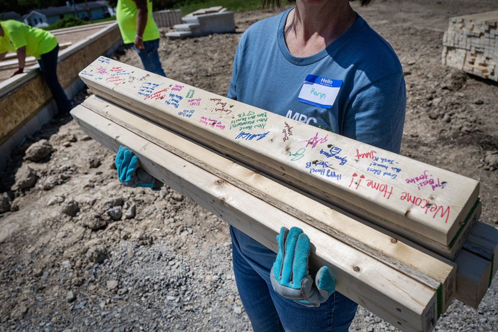 Two-by-fours signed by Marathon Petroleum employees will be used to build a new Habitat for Humanity home.