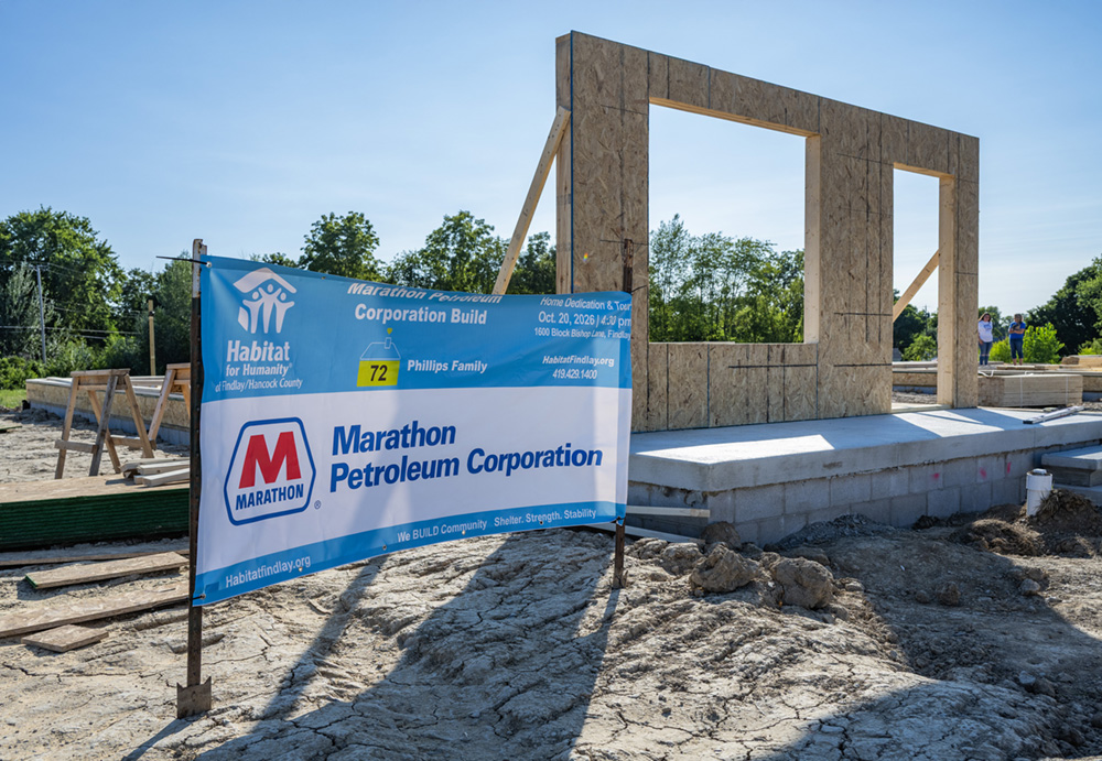 A Marathon Petroleum sign stands outside the Habitat for Humanity home the company is fully funding.