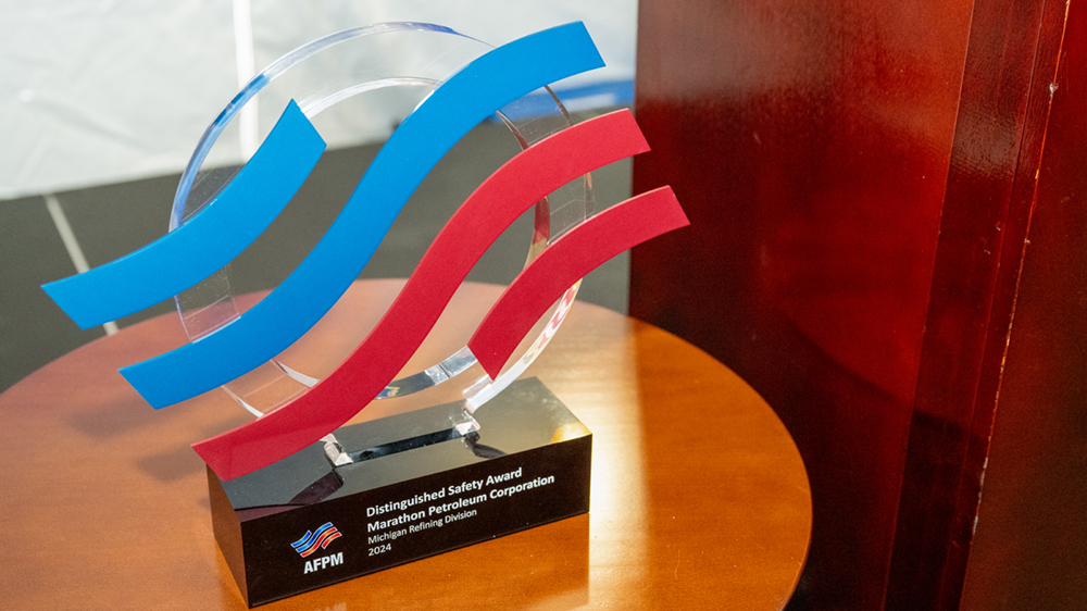 An award sits on a table next to a podium.