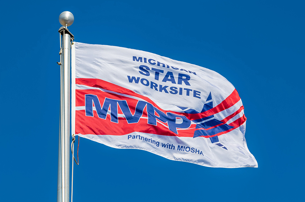 A Michigan STAR Worksite MVPP flag flying on a flagpole. 