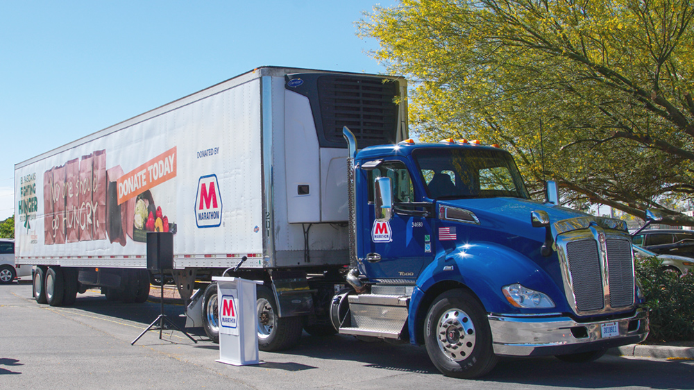 A semi-truck in a parking lot.
