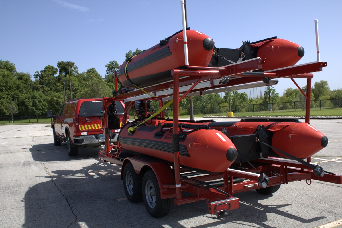 A trailer carrying two pontoon rescue boats.