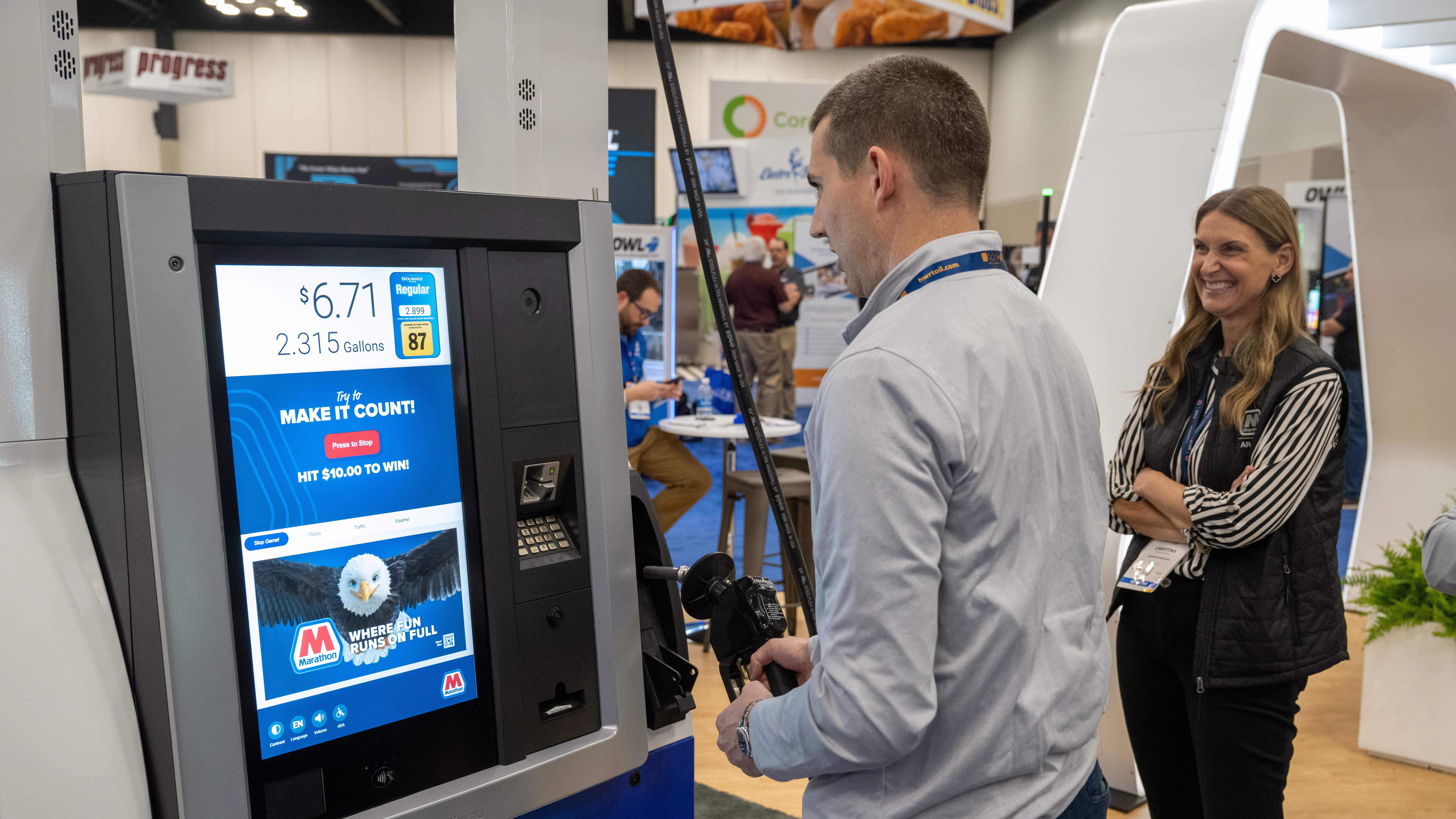 Marathon-branded fuel pump display inside a tradeshow booth.