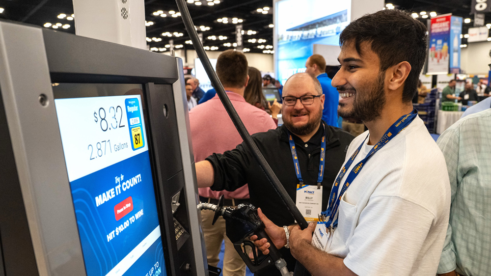  A Marathon-branded fuel pump display inside a tradeshow booth as a participant takes part in the Make It Count challenge.
