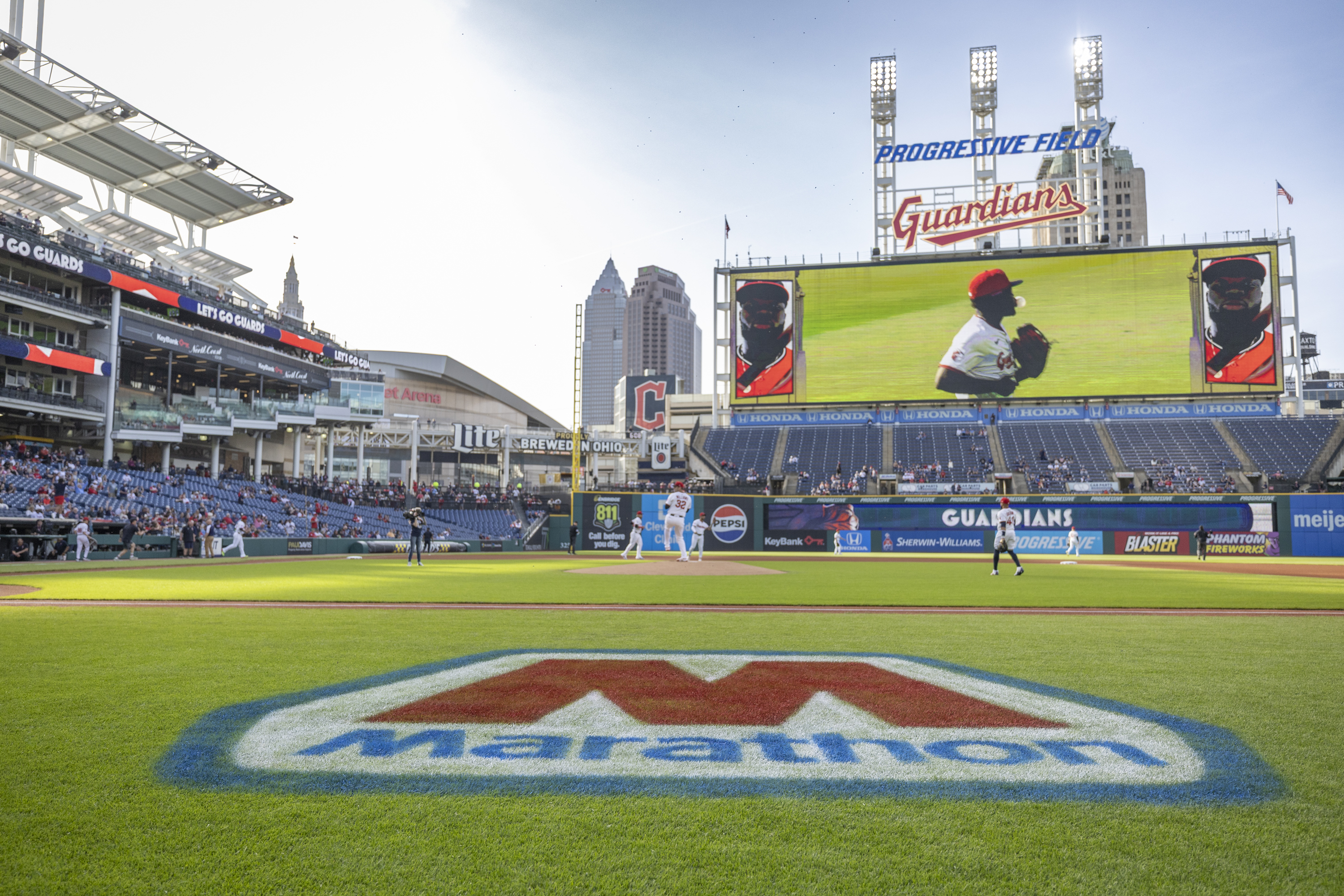 Large Marathon &ldquo;M&rdquo; logo displayed on a baseball field.