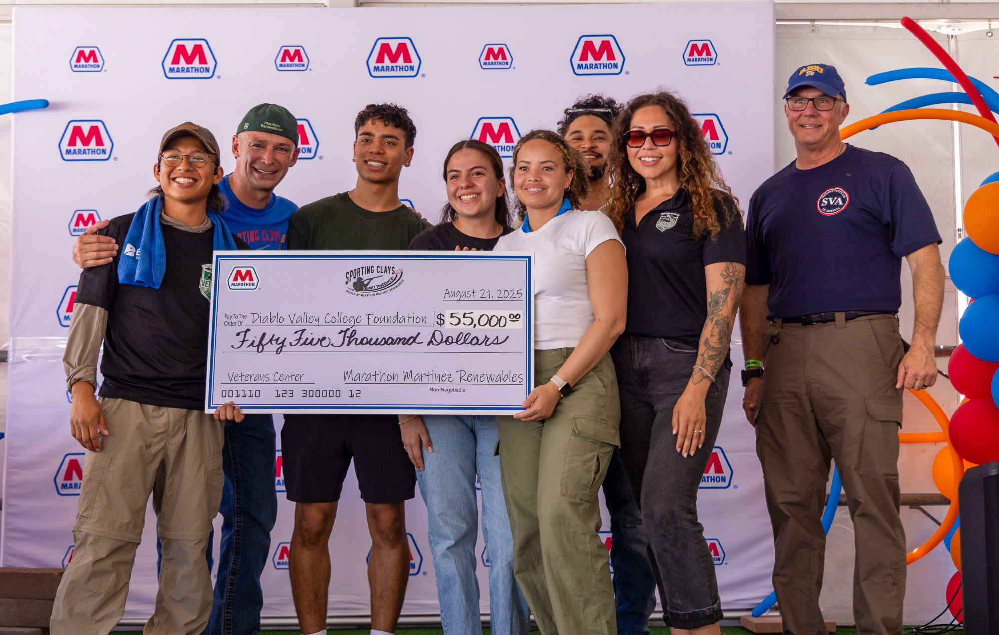 A group of people holding a large check for $55,000 to the Diablo Valley College Foundation. A group of people holding a large check for $55,000 to the Diablo Valley College Foundation.
