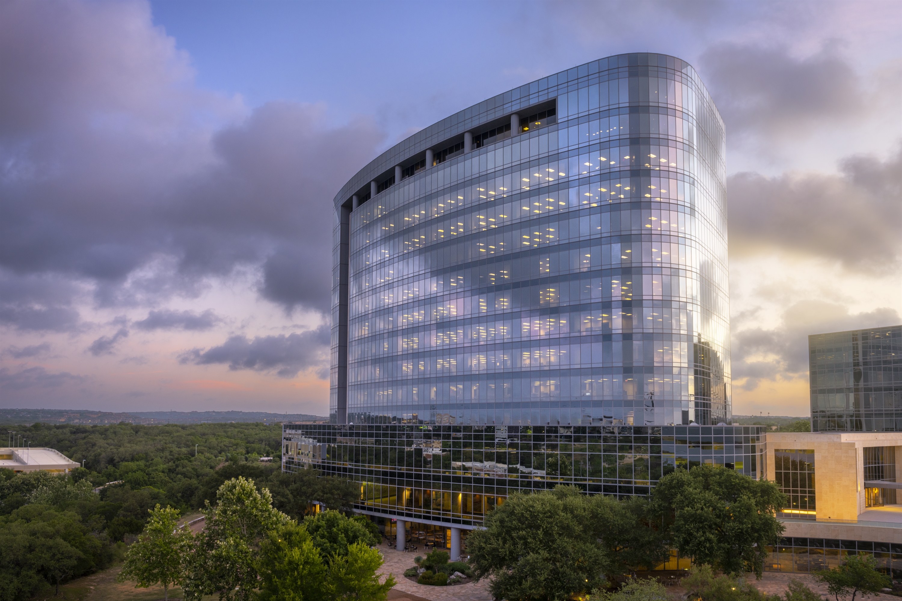 An office building surrounded by trees. 