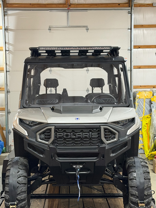 Front view of an all-terrain rescue vehicle inside a building.